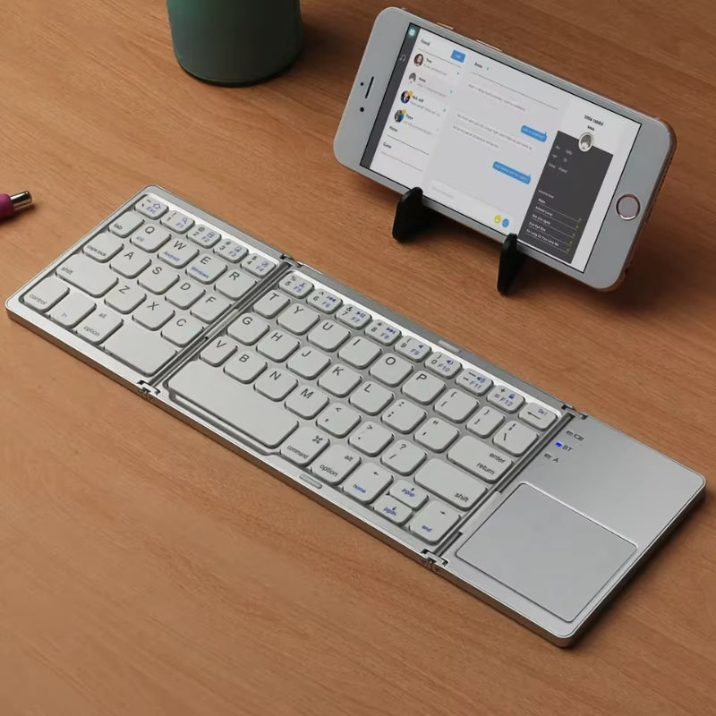 Teclado Bluetooth portátil
Teclado con touchpad integrado
Teclado compatible con Android, iOS y Windows
Teclado inalámbrico compacto
Teclado para tablet y smartphone
Teclado de viaje con touchpad
Teclado plegable Bluetooth
Teclado recargable de larga duración
